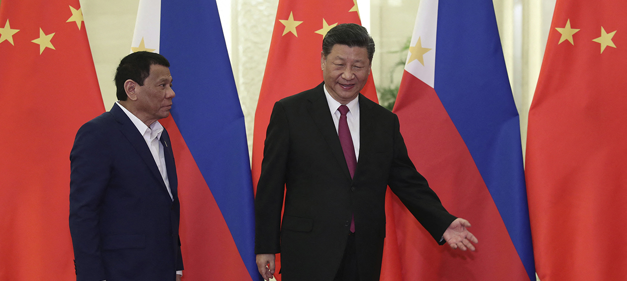 Philippine President Rodrigo Duterte (L) is shown the way by Chinese President Xi Jinping before their meeting at the Great Hall of People in Beijing on April 25, 2019. (Photo by Kenzaburo FUKUHARA / POOL / AFP)